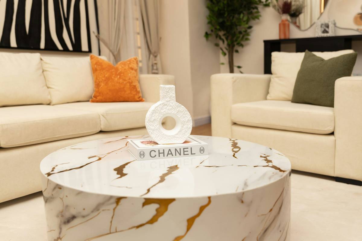 Wall clock decorative home design styled with matching brass accessories in a curated entryway