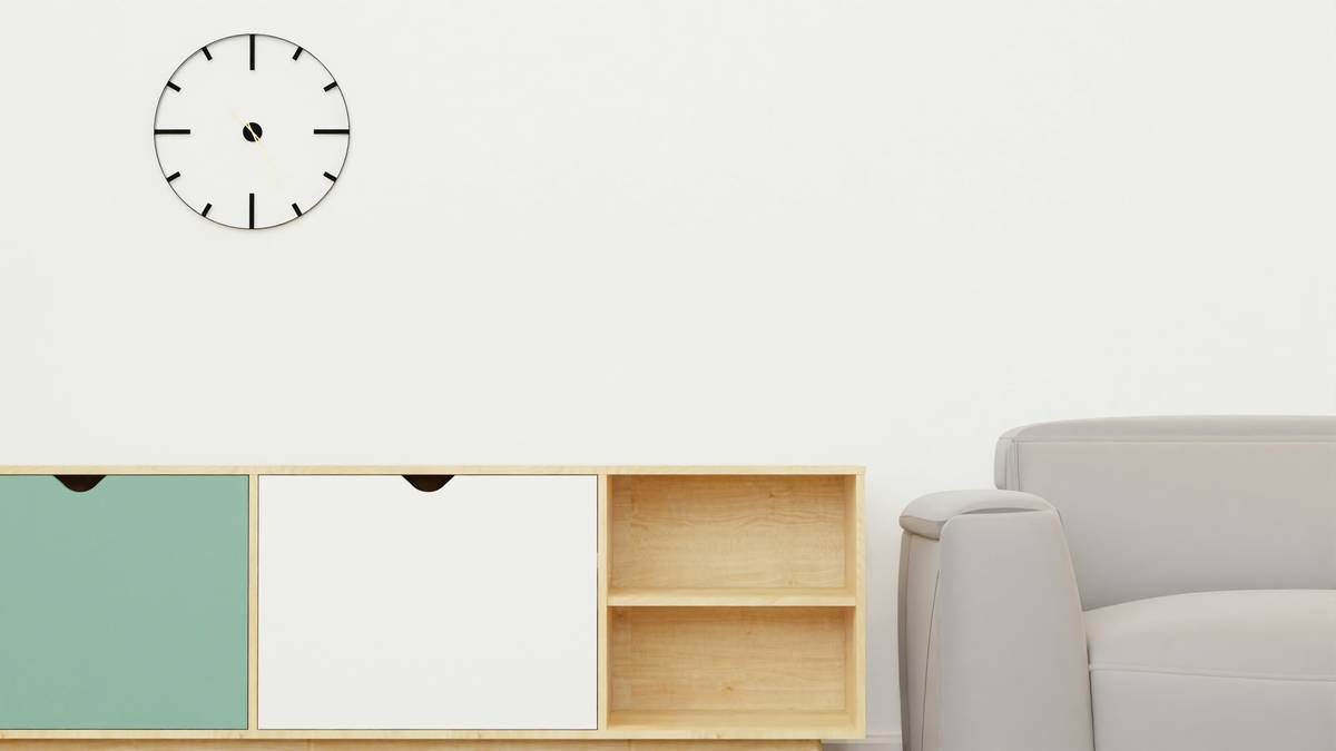 decorative clocks for walls displayed in various home settings including living room and hallway
